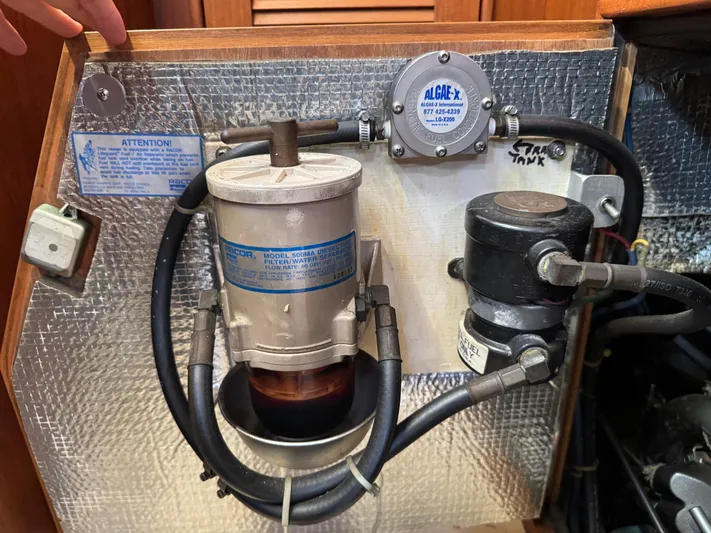 Otter II Yacht Photos Pics Fuel filtration system in a 1999 Island Packet 45 sailboat engine compartment.