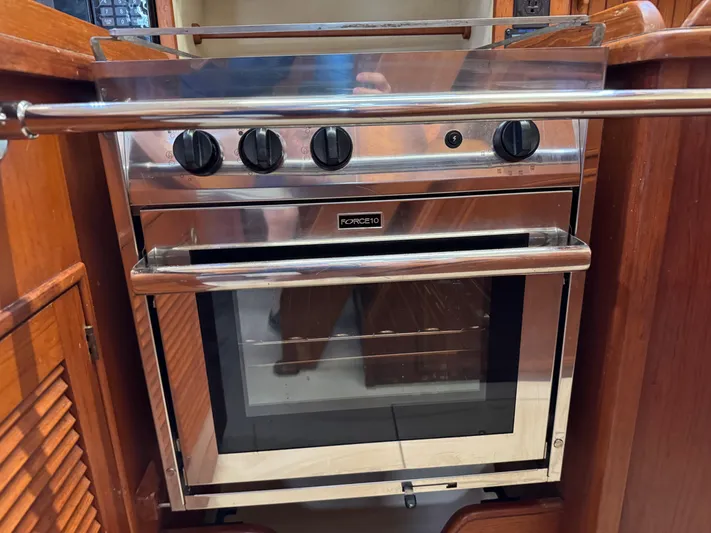 Otter II Yacht Photos Pics Stainless steel oven in 1999 Island Packet 45 yacht kitchen.