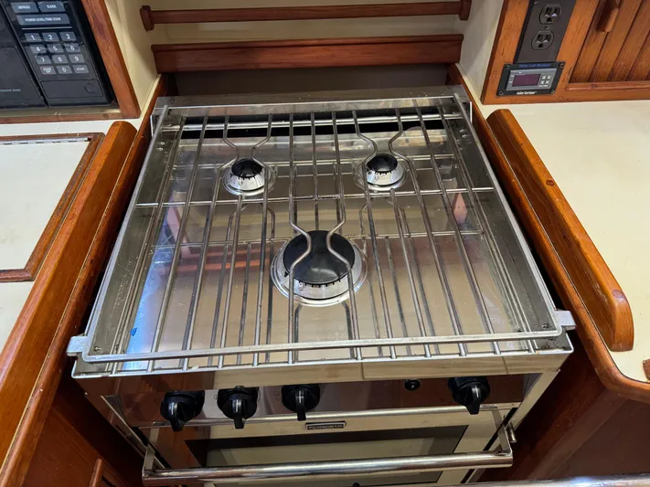 Otter II Yacht Photos Pics Stainless steel stove in 1999 Island Packet 45 yacht kitchen.