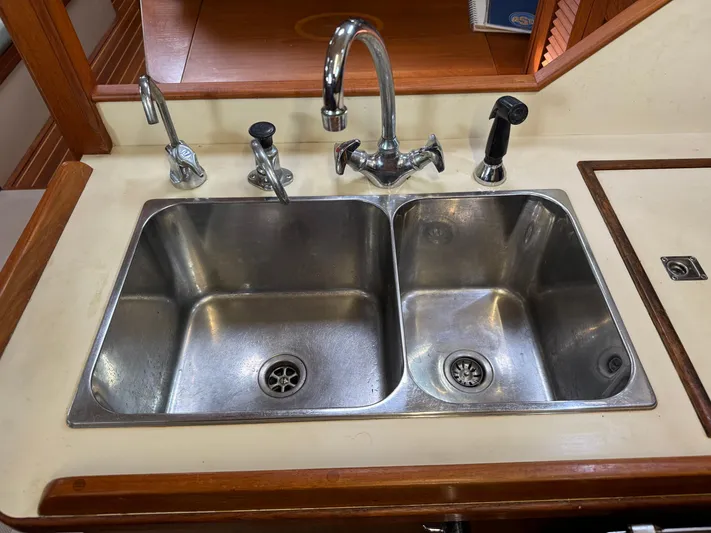 Otter II Yacht Photos Pics Stainless steel double sink in 1999 Island Packet 45 yacht kitchen.