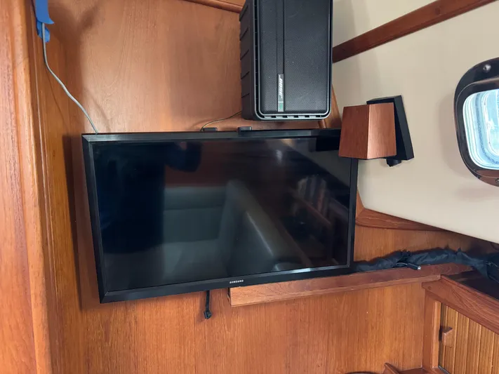 Otter II Yacht Photos Pics Flat-screen TV and speaker in 1999 Island Packet 45 yacht interior.