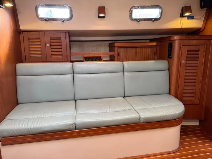Otter II Yacht Photos Pics Interior of 1999 Island Packet 45 yacht with leather seating and wooden cabinetry.