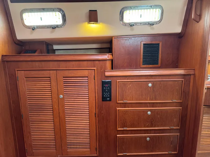 Otter II Yacht Photos Pics Interior of 1999 Island Packet 45 sailboat with wooden cabinets and drawers.