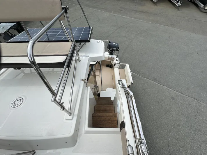  Yacht Photos Pics 2016 Cutwater CB boat deck with solar panel and wooden steps.
