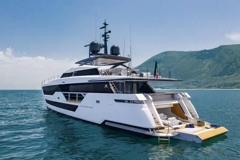 Ciao M Yacht Photos Pics Luxurious 2023 Custom Line 106' yacht cruising in scenic coastal waters.