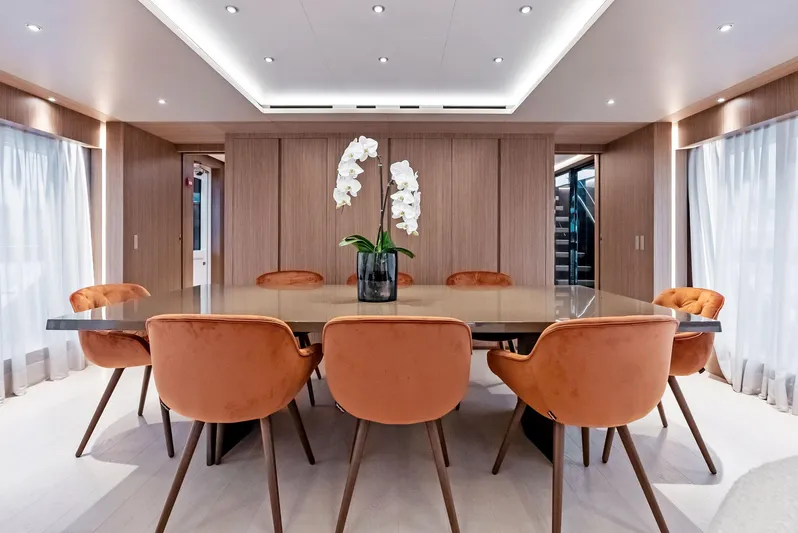 Ciao M Yacht Photos Pics Luxurious dining area on 2023 Custom Line 106' yacht with elegant decor and seating.