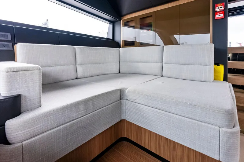 Ciao M Yacht Photos Pics Luxurious interior of 2023 Custom Line 106' yacht with modern gray seating.
