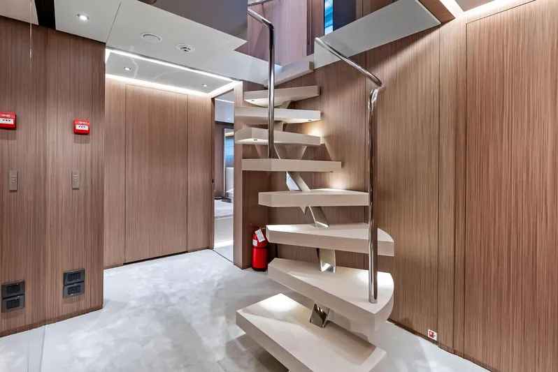 Ciao M Yacht Photos Pics Modern yacht interior with sleek spiral staircase, Custom Line 106', 2023 model.
