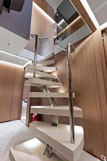 Ciao M Yacht Photos Pics Modern spiral staircase in 2023 Custom Line 106' yacht interior.