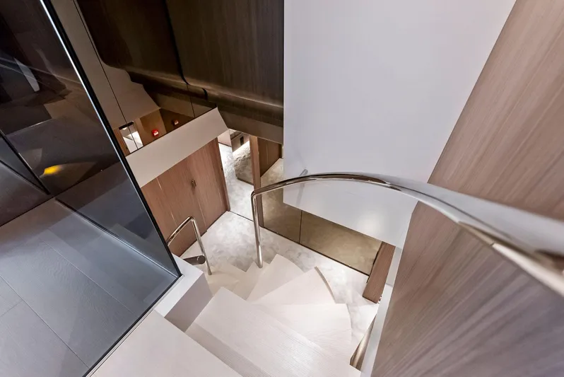 Ciao M Yacht Photos Pics Luxurious interior staircase of 2023 Custom Line 106' yacht.