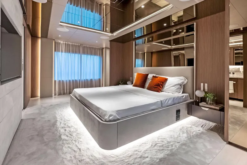 Ciao M Yacht Photos Pics Luxurious 2023 Custom Line 106' yacht bedroom with modern design and ambient lighting.