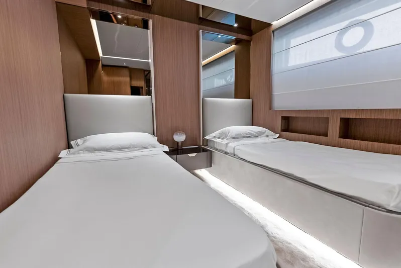Ciao M Yacht Photos Pics Luxurious twin bedroom on 2023 Custom Line 106' yacht, featuring modern design and elegant wood paneling.