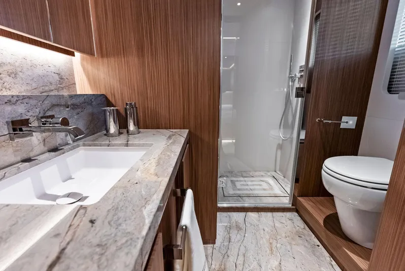 Ciao M Yacht Photos Pics Luxurious 2023 Custom Line 106' yacht bathroom with marble countertops and modern fixtures.