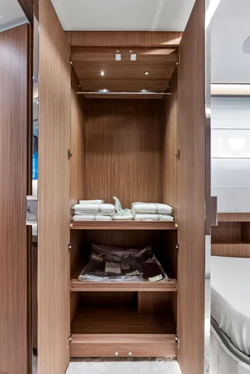 Ciao M Yacht Photos Pics Luxurious wooden wardrobe interior on 2023 Custom Line 106' yacht.