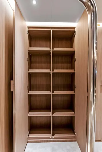 Ciao M Yacht Photos Pics Spacious wooden shelving unit inside 2023 Custom Line 106' yacht.