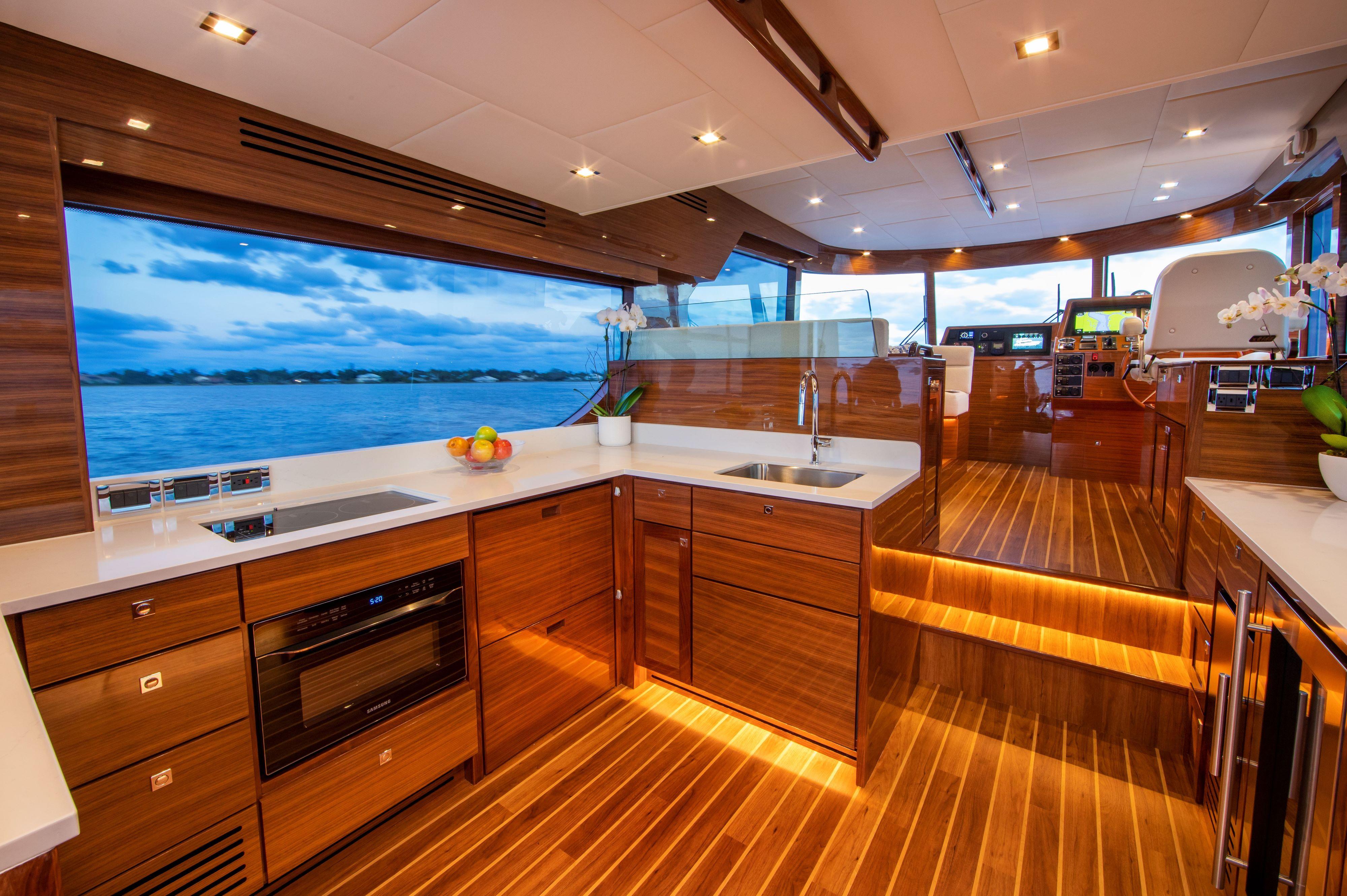 Luxurious kitchen interior of 2025 Summit 54 yacht with modern appliances and ocean view.