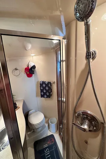 Invictus II Yacht Photos Pics Bathroom interior of 2006 Meridian 368 yacht with shower and toilet.