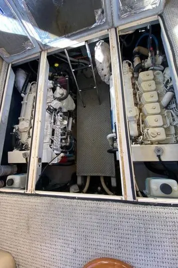 Invictus II Yacht Photos Pics Engine room of a 2006 Meridian 368 yacht, showcasing dual engines and mechanical components.