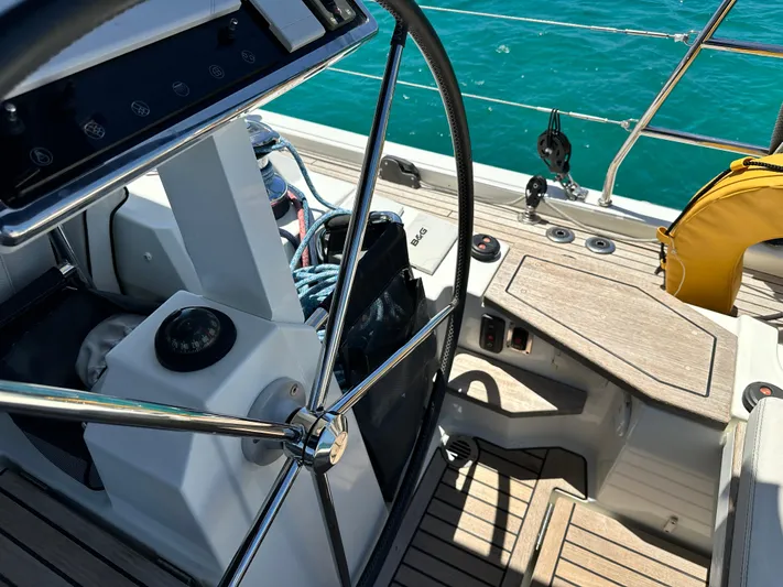 Yacht Photos Pics Cockpit of 2019 Beneteau Oceanis Yacht 62 with steering wheel and teak decking.