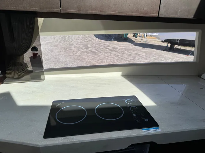  Yacht Photos Pics Modern kitchen in 2021 Galeon 425 HTS yacht with sleek induction cooktop.