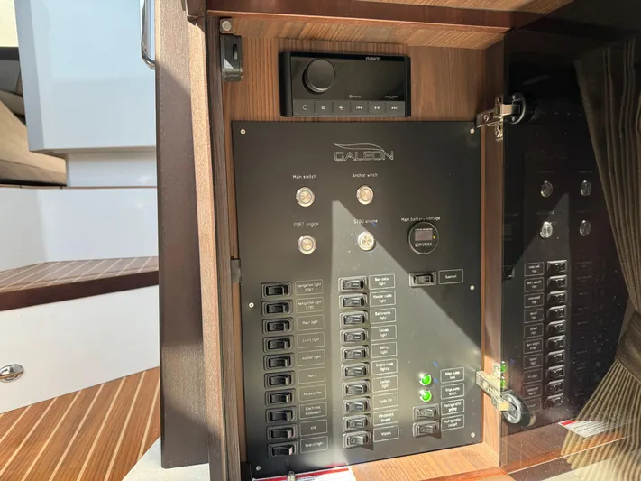 Yacht Photos Pics Control panel inside 2021 Galeon 425 HTS yacht, featuring switches and a Fusion audio system.