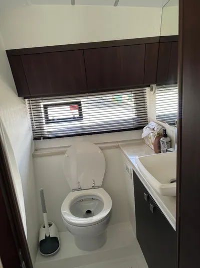  Yacht Photos Pics Modern bathroom interior on 2021 Galeon 425 HTS yacht, featuring toilet and sink.