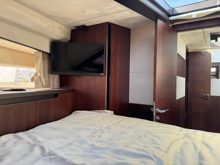  Yacht Photos Pics Luxurious interior of 2021 Galeon 425 HTS yacht with TV and wooden finishes.