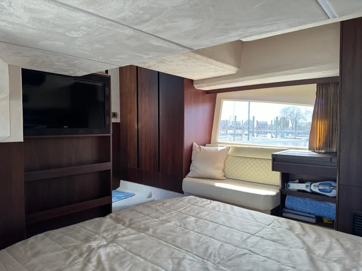  Yacht Photos Pics Luxurious interior of 2021 Galeon 425 HTS yacht with TV, bed, and window view.