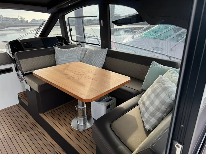  Yacht Photos Pics Luxurious interior of 2021 Galeon 425 HTS yacht with elegant seating and wooden table.