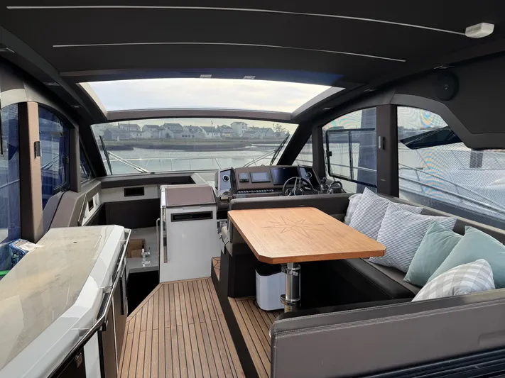  Yacht Photos Pics Luxurious interior of 2021 Galeon 425 HTS yacht with seating and navigation area.