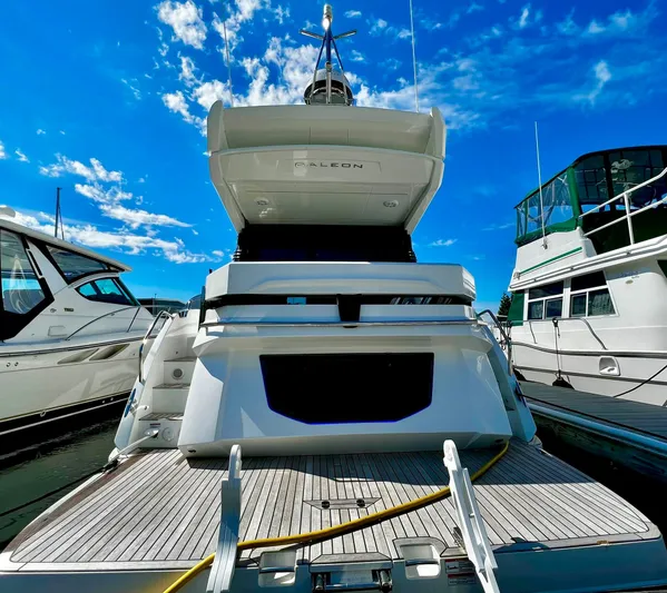  Yacht Photos Pics 2021 Galeon 425 HTS yacht docked under a clear blue sky.