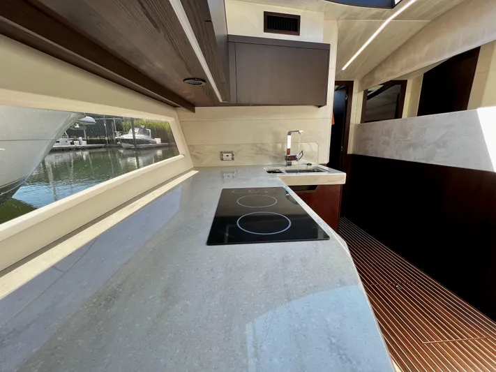  Yacht Photos Pics Modern kitchen interior of 2021 Galeon 425 HTS yacht with sleek countertops and appliances.