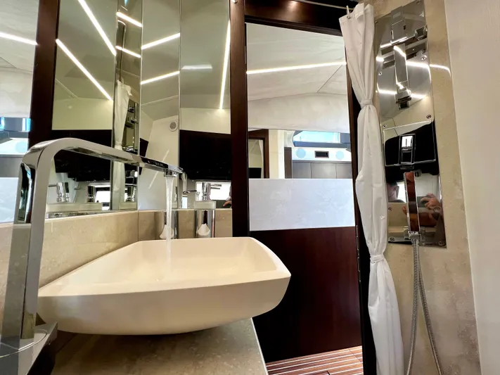  Yacht Photos Pics Luxurious bathroom interior of 2021 Galeon 425 HTS yacht with modern sink and fixtures.