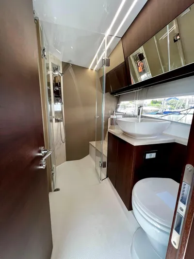  Yacht Photos Pics Luxurious bathroom interior of 2021 Galeon 425 HTS yacht with modern fixtures and glass shower.