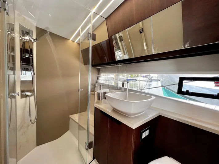  Yacht Photos Pics Luxurious bathroom in 2021 Galeon 425 HTS yacht with modern fixtures and elegant design.