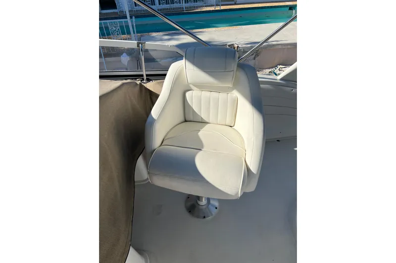 Quick X Yacht Photos Pics White captain's chair on 2004 Cruisers Yachts 3750 Motoryacht deck.