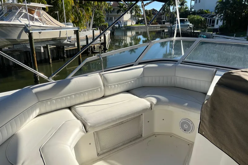 Quick X Yacht Photos Pics 2004 Cruisers Yachts 3750 Motoryacht with spacious seating, docked in a serene marina.