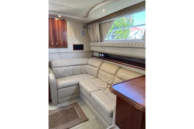 Quick X Yacht Photos Pics Luxurious interior of 2004 Cruisers Yachts 3750 Motoryacht with leather seating and wood accents.