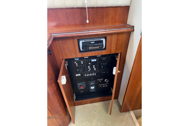 Quick X Yacht Photos Pics 2004 Cruisers Yachts 3750 Motoryacht electrical panel with open cabinet doors.