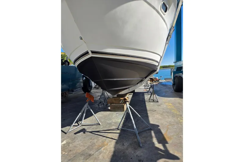 Quick X Yacht Photos Pics 2004 Cruisers Yachts 3750 Motoryacht on stands, hull view, outdoor setting.