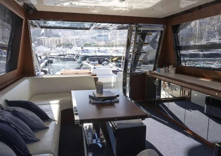  Yacht Photos Pics Luxurious interior of 2021 Riva 66' Ribelle yacht with marina view.