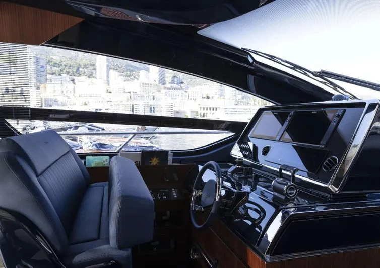 Yacht Photos Pics Interior of 2021 Riva 66' Ribelle yacht with modern dashboard and city view.