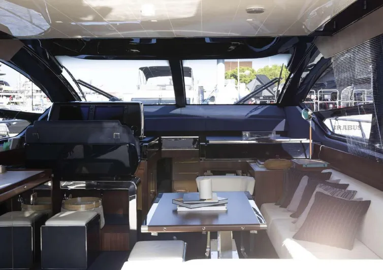  Yacht Photos Pics Luxurious interior of 2021 Riva 66' Ribelle yacht with modern furnishings and panoramic windows.
