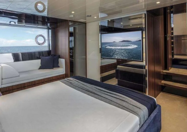  Yacht Photos Pics Luxurious interior of 2021 Riva 66' Ribelle yacht with elegant bedroom and sea view.
