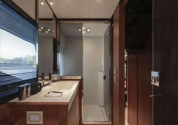  Yacht Photos Pics Luxurious bathroom interior of 2021 Riva 66' Ribelle yacht with modern fixtures.
