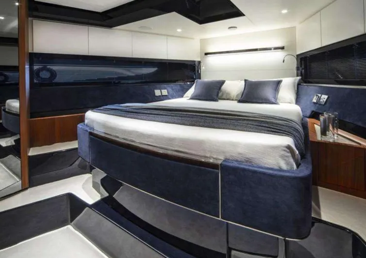  Yacht Photos Pics Luxurious bedroom interior of 2021 Riva 66' Ribelle yacht with modern design.