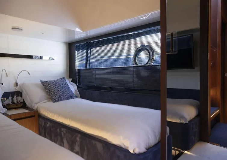  Yacht Photos Pics Interior of 2021 Riva 66' Ribelle yacht with twin beds and modern decor.