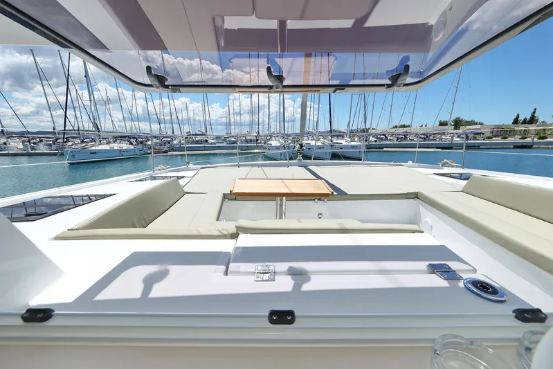 Breeze Yacht Photos Pics Luxurious Bali 4.4 yacht interior, 2025 model, docked at a marina with clear skies.