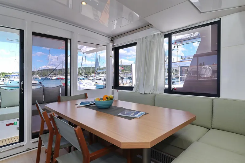 Breeze Yacht Photos Pics Interior of 2025 Bali 4.4 yacht with dining area and marina view.