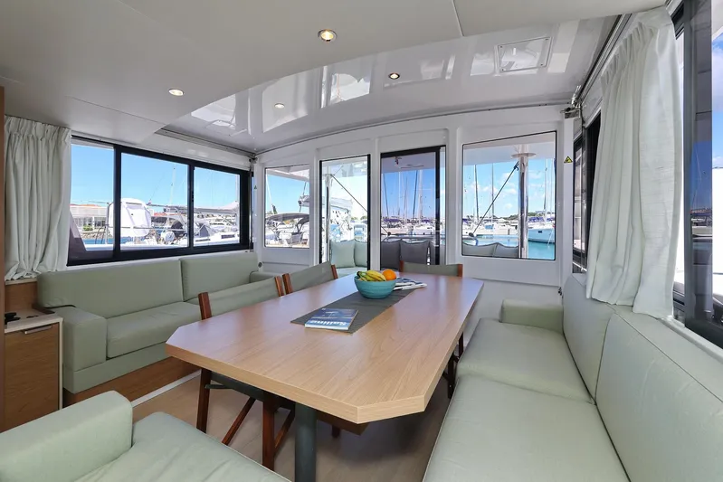 Breeze Yacht Photos Pics Spacious interior of 2025 Bali 4.4 yacht with large windows and comfortable seating.